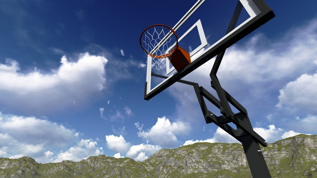 A basket hoop viewed from below. In the background: a Californian sky and a mountain rim.