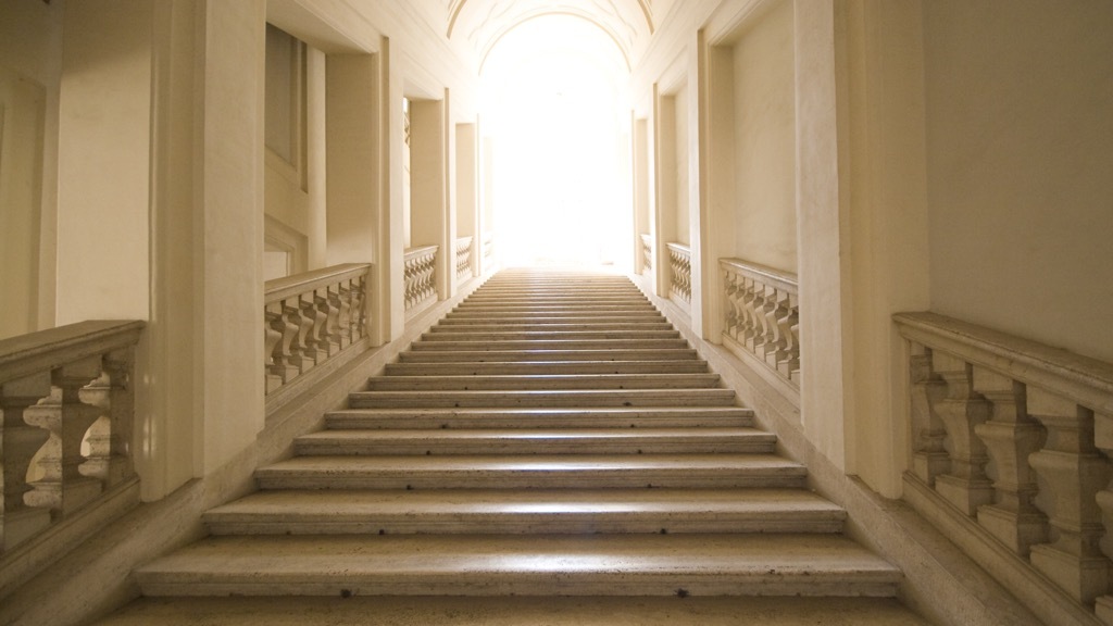 A white marble stairway leads up to a bright light. Could it possibly be heaven?