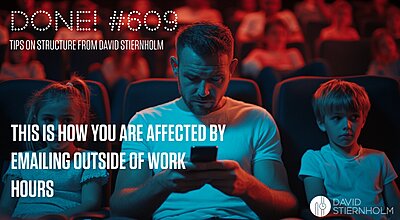 A father sits in a movie theater focused on his phone while two children next to him look disappointed.