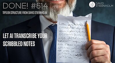 A man with a gray beard in a suit is holding a piece of paper with handwritten text and a yellow pencil.