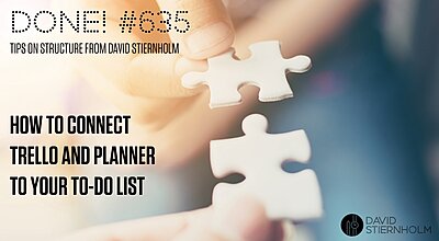 Two hands are holding puzzle pieces, carefully bringing them together to find a perfect fit.