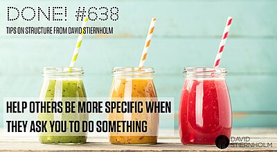 Three colorful smoothies—green, orange, and red—are served in glass jars with striped paper straws against a light blue wooden background.