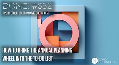 A large pink circle is squeezed into a blue square frame filled with geometric shapes in pastel tones of orange, red, and blue.