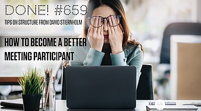 A frustrated woman sits at her desk with her hands covering her face, looking overwhelmed in front of her laptop.