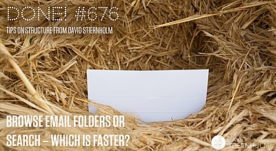 A blank white card is resting in a hollow indentation within a bale of golden straw.