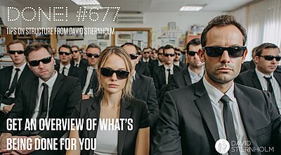 A large group of people wearing black suits and dark sunglasses are seated in what appears to be an office or classroom setting.